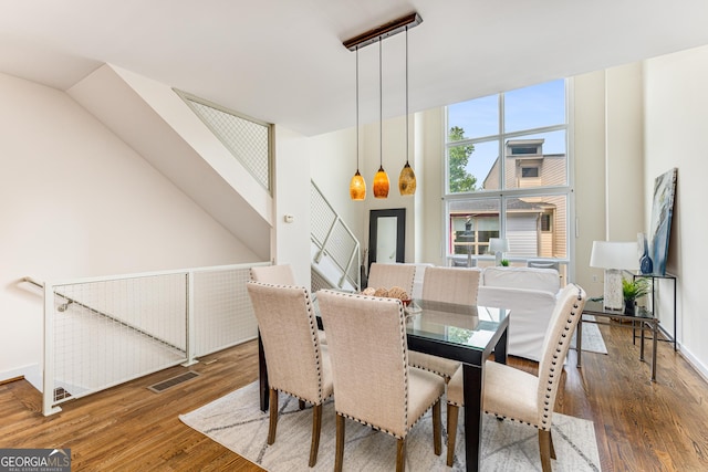 dining room with dark hardwood / wood-style flooring