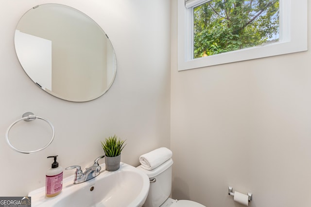 bathroom with toilet and sink