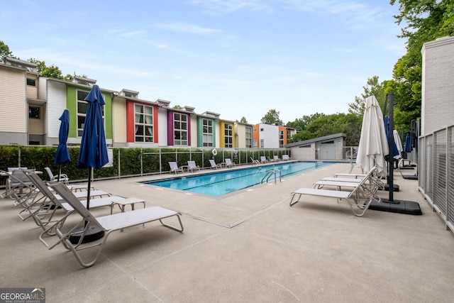 view of swimming pool featuring a patio area