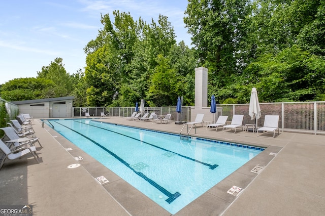 view of swimming pool featuring a patio area