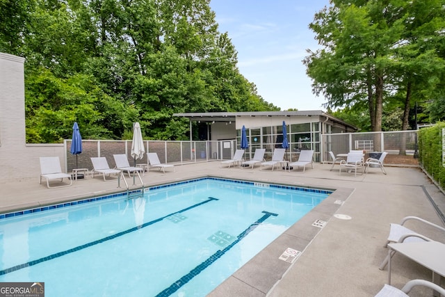 view of swimming pool featuring a patio