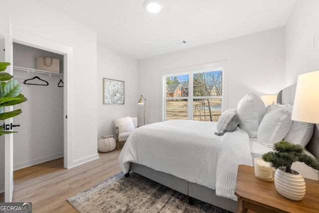 bedroom with light hardwood / wood-style flooring