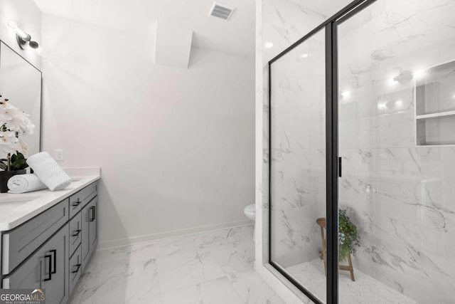 bathroom with vanity, toilet, and an enclosed shower