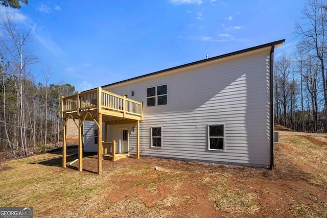 back of house featuring a deck