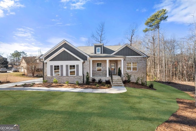 craftsman inspired home with a porch and a front yard