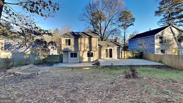 back of house with a patio area