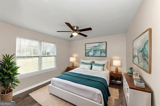 bedroom featuring ceiling fan and dark hardwood / wood-style flooring