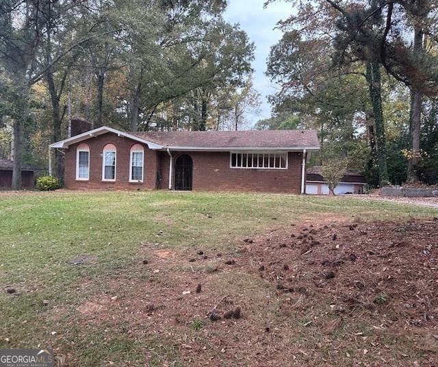 ranch-style house with a front lawn