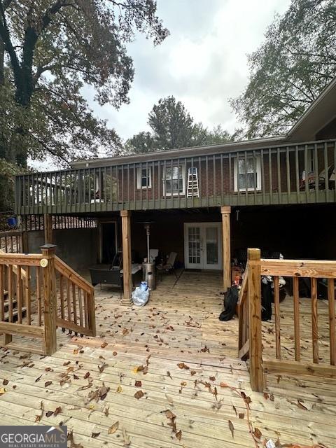 rear view of property with a wooden deck