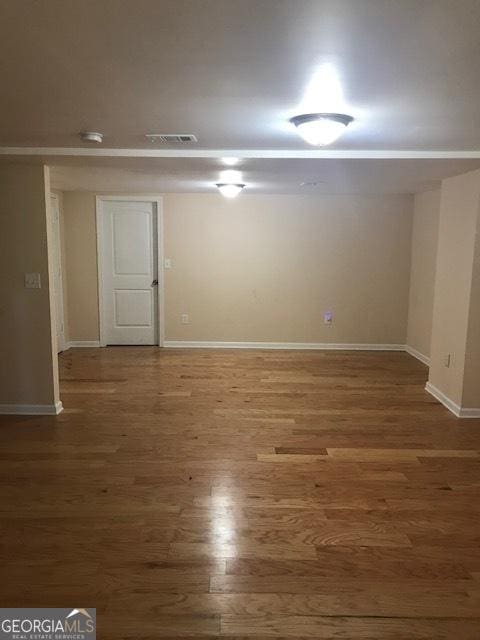 basement featuring wood-type flooring