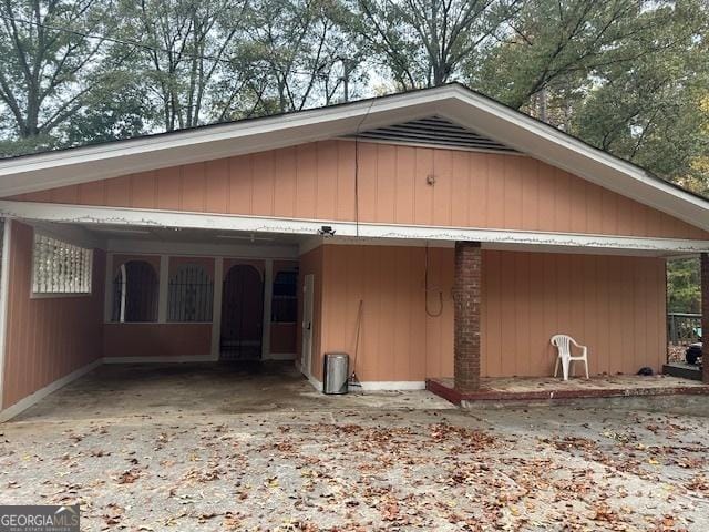 rear view of house with a carport