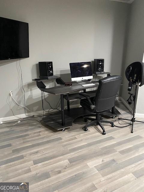 office area with light hardwood / wood-style floors