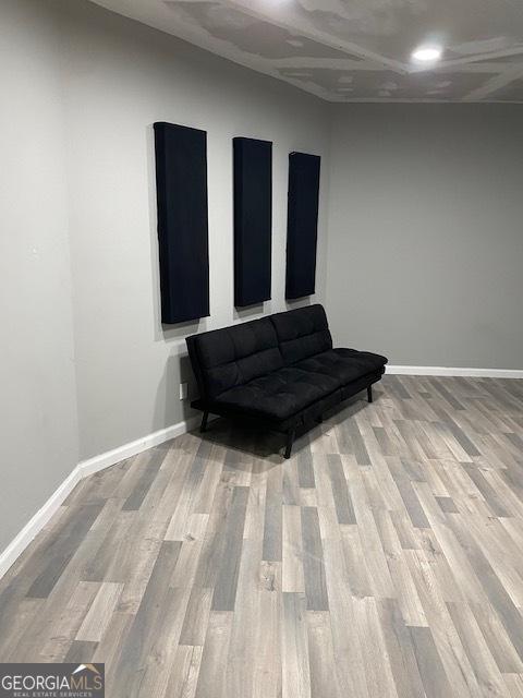 living area with light hardwood / wood-style flooring