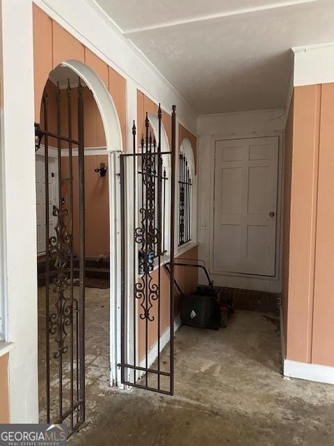 hall featuring concrete flooring