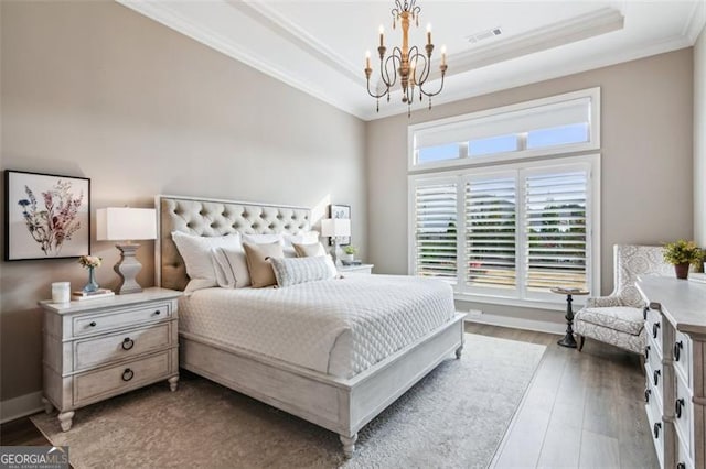 dining space with crown molding, dark hardwood / wood-style floors, and a notable chandelier