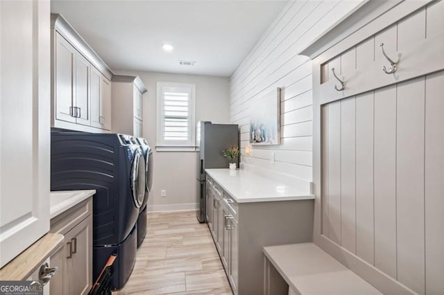 bathroom featuring toilet, a shower with shower door, and vanity