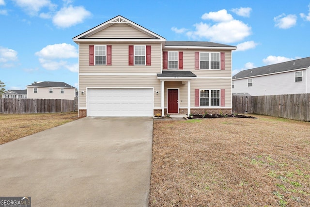 front facade featuring a front yard and a garage