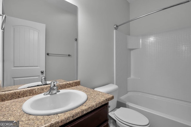 full bathroom featuring shower / tub combination, vanity, and toilet