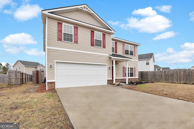 view of front property featuring a garage and a front lawn