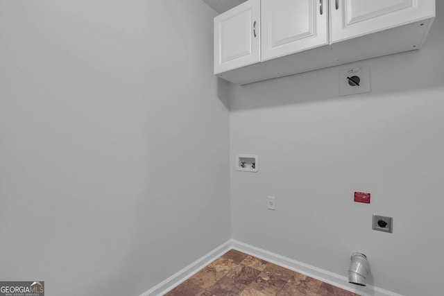 washroom featuring washer hookup, electric dryer hookup, and cabinets