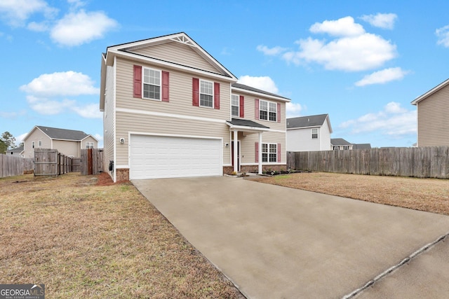 front facade featuring a front yard and a garage