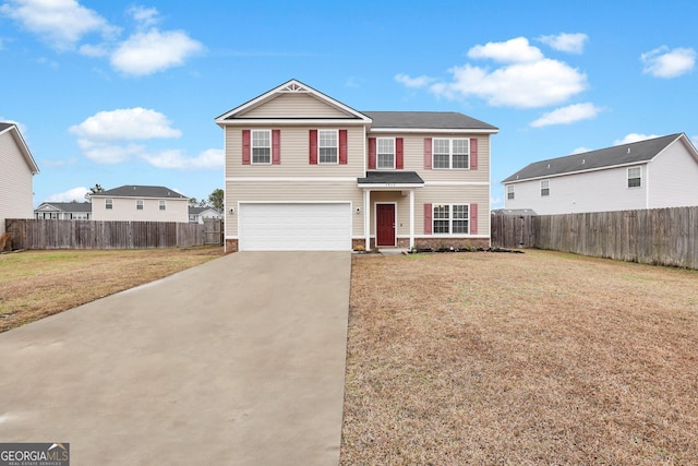 view of front of house featuring a front lawn and a garage