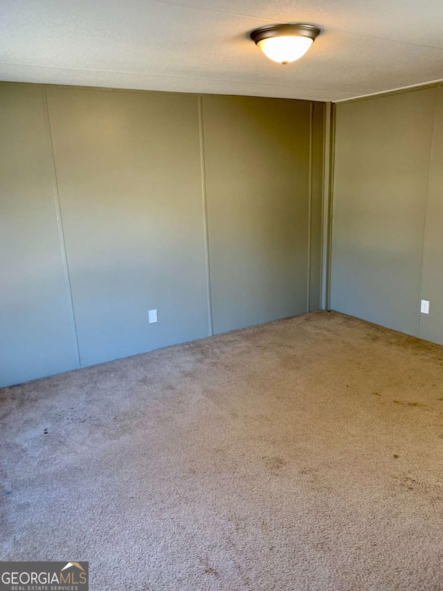 unfurnished room with carpet floors