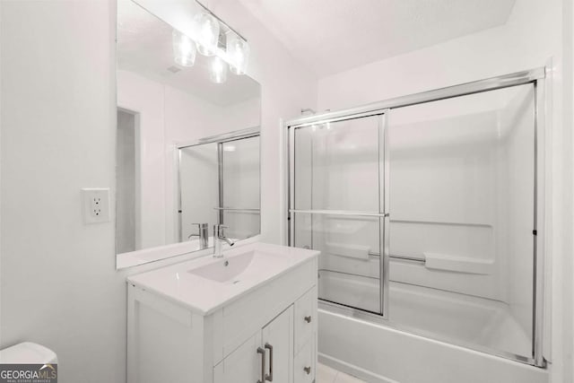 full bathroom featuring toilet, vanity, and combined bath / shower with glass door