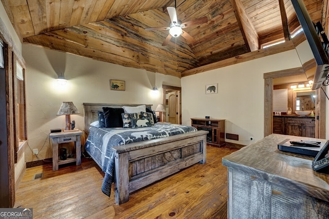 bedroom with ceiling fan, wooden ceiling, hardwood / wood-style floors, and high vaulted ceiling