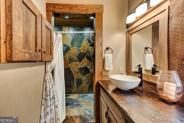 bathroom featuring vanity and a shower with curtain