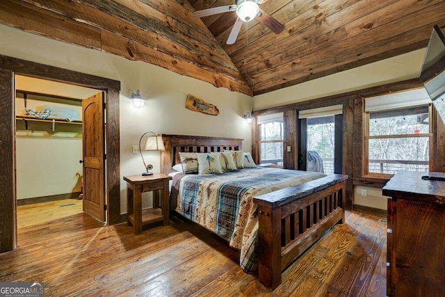 bedroom featuring lofted ceiling, wood-type flooring, ceiling fan, and wooden ceiling