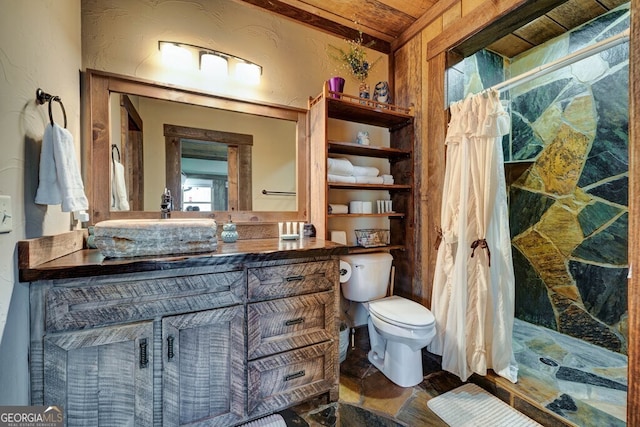 bathroom with curtained shower, toilet, and vanity