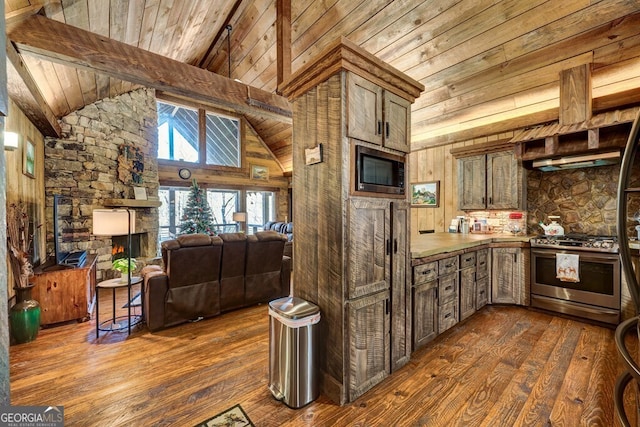 kitchen with beam ceiling, appliances with stainless steel finishes, dark hardwood / wood-style flooring, and high vaulted ceiling