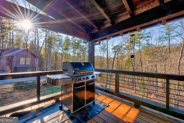 wooden terrace with area for grilling