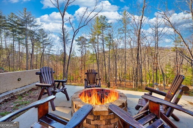 view of patio / terrace featuring an outdoor fire pit