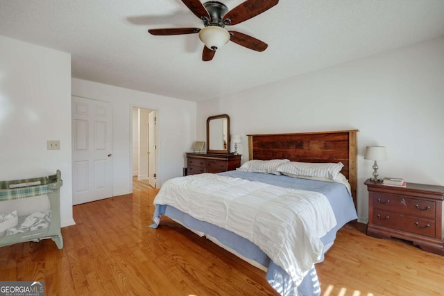 bedroom featuring ceiling fan and light hardwood / wood-style floors