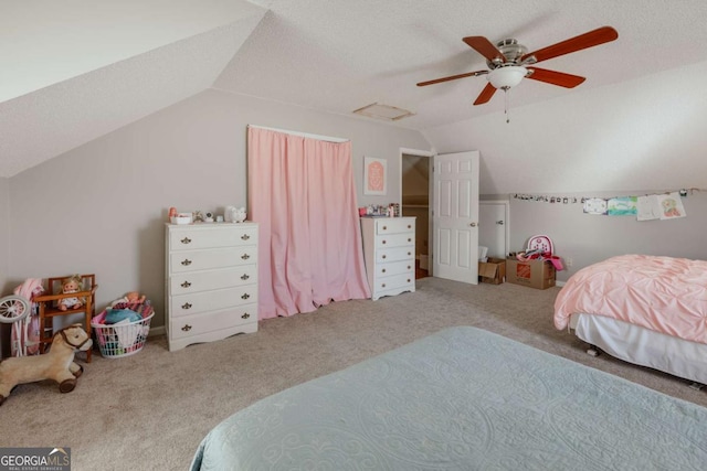 bedroom featuring carpet flooring, a textured ceiling, ceiling fan, and lofted ceiling