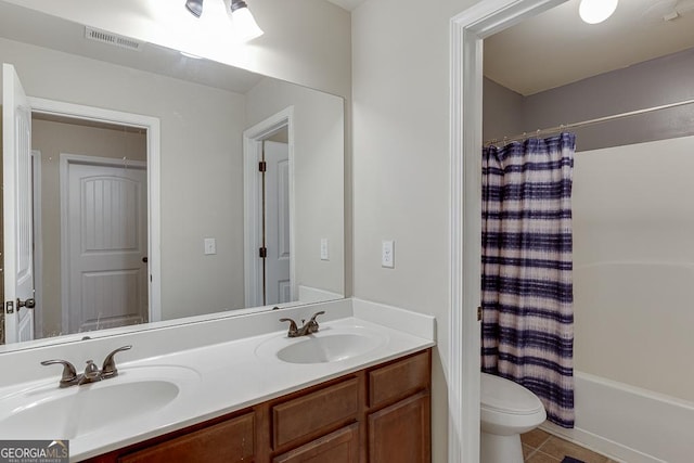 full bathroom featuring tile patterned floors, vanity, shower / tub combo, and toilet