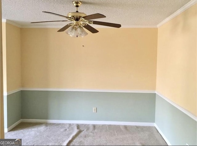 unfurnished room featuring a textured ceiling, ceiling fan, ornamental molding, and light carpet