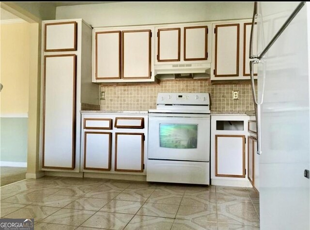 kitchen with backsplash, white cabinetry, fridge, and white electric range