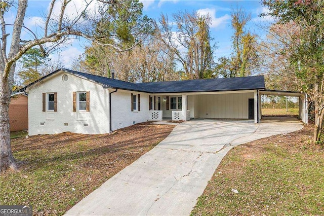 single story home featuring a carport