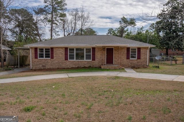 single story home with a front lawn