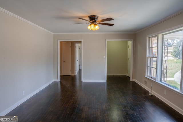 unfurnished room featuring dark hardwood / wood-style flooring, ornamental molding, and ceiling fan