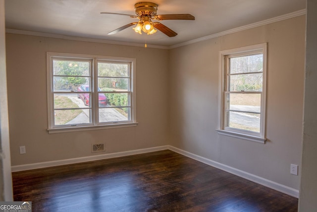 empty room with ceiling fan, dark wood-type flooring, and a healthy amount of sunlight