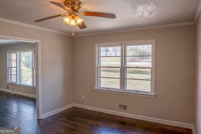 unfurnished room featuring ceiling fan, ornamental molding, and dark hardwood / wood-style floors