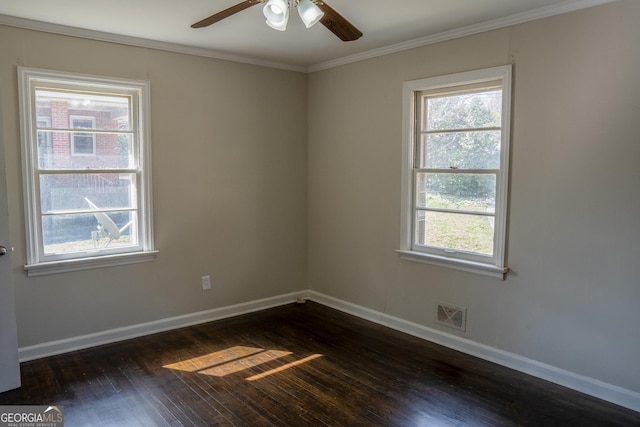 spare room with crown molding, ceiling fan, and dark hardwood / wood-style floors