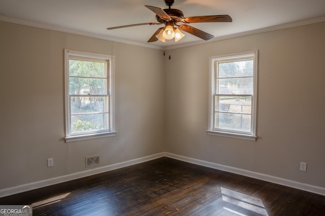 spare room with dark wood-type flooring, ornamental molding, and ceiling fan