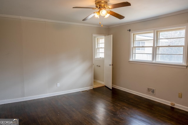 spare room featuring crown molding, dark hardwood / wood-style floors, and ceiling fan