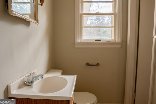 bathroom with vanity and toilet