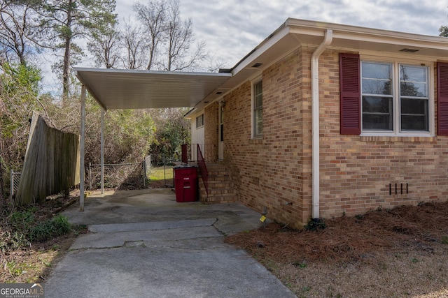 view of home's exterior with a carport